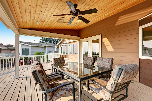 istock Large wooden walkout deck with flat roof extension 598962852