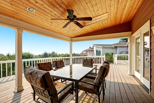 istock Large wooden walkout deck with seating arrangement 598962984