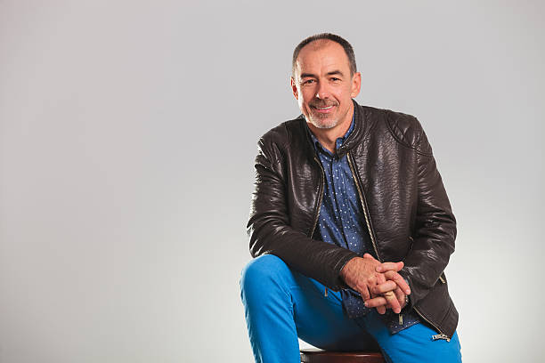 istock smiling mature man in leather jacket resting 598963012