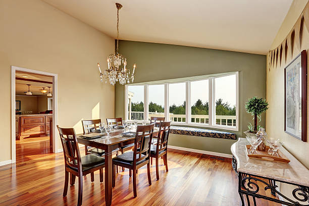 istock Elegant dining room with contrast olive wall and hardwood floor 598963628