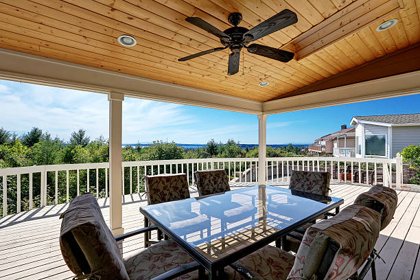 istock Large wooden walkout deck with flat roof extension 599099642