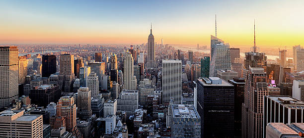 New York City. Manhattan downtown skyline. New York City. Manhattan downtown skyline with illuminated Empire State Building and skyscrapers at sunset. empire state building photos stock pictures, royalty-free photos & images
