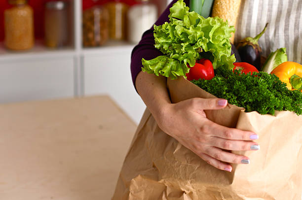 istock Assorted fruits and vegetables in brown grocery bag holding a 599103518