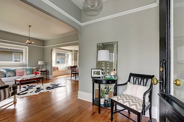 istock Entryway with gray walls, console table and wood floors 599104094