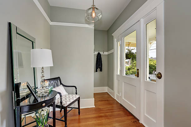 istock Entryway with gray walls, console table and wood floors 599104218