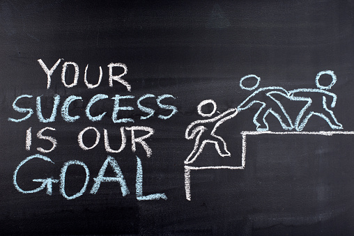 Your success is our goal hand drawing on blackboard,business concept