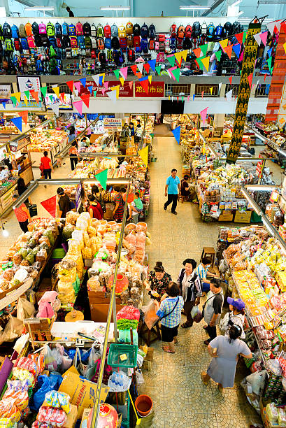 Warorot indoor market Chiang Mai Thailand - September 2, 2016 : Warorot indoor market, Unidentified Chinese tourists come to shopping at market, center of the market town of Chiang Mai and tourists, market offers many products, open daily and this market must not miss visiting. warorot stock pictures, royalty-free photos & images