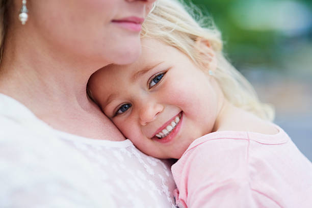 small baby in his mother's arm