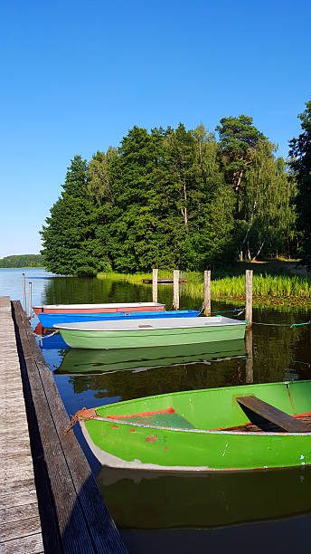 istock evening light at lake with boats and jetty 599110958