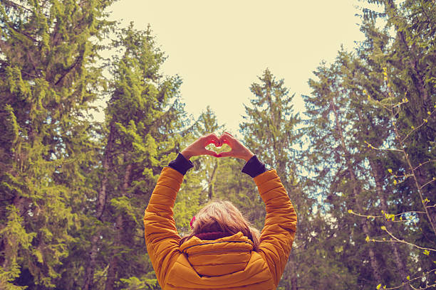 istock Girl sharing her heart with the nature. 599110990