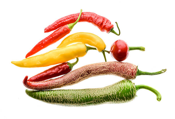 istock Different variety of hot peppers or chilies, isolated on white. 599111388