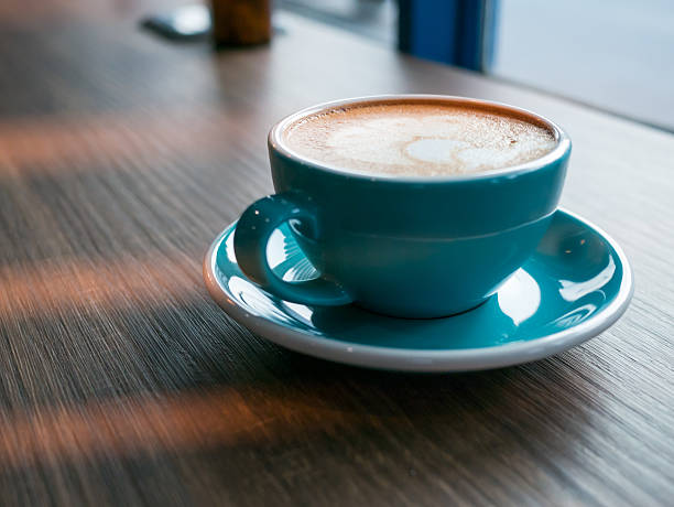 istock Hot coffee late art in cup on table, image vintage, 599111720