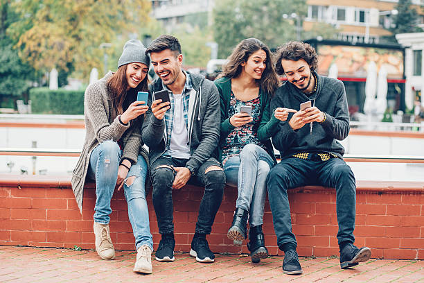 istock Friends with smart phones 599111836
