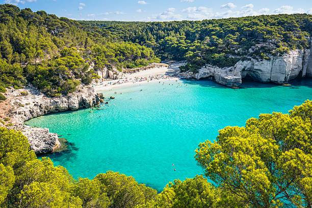 пляж в menorca - beauty in nature blue bush color image стоковые фото и изображения