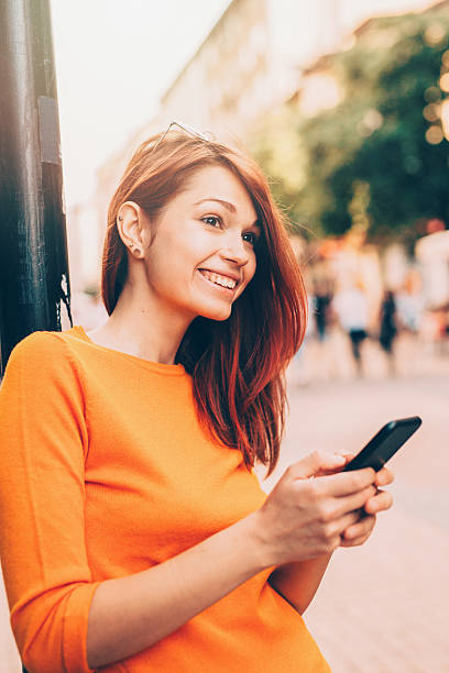 istock Woman texting outdoor 599113162