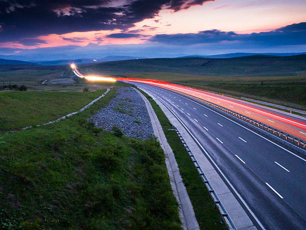 istock light trails on motorway highway at night, long exposure abstract 599113770