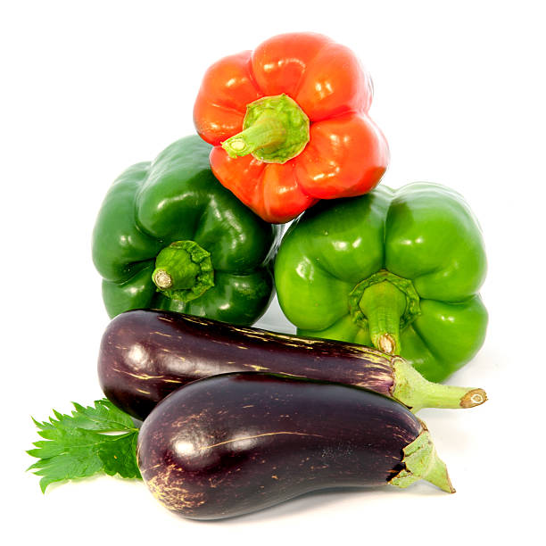 istock Eggplant and colorful peppers on white background 599114092