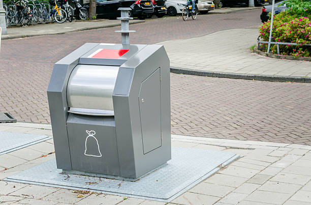 istock Modern Trash Container along a Cobbled Street 599114114