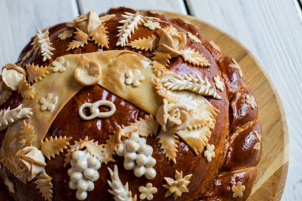 istock Decorated loaf on wooden board. 599114322