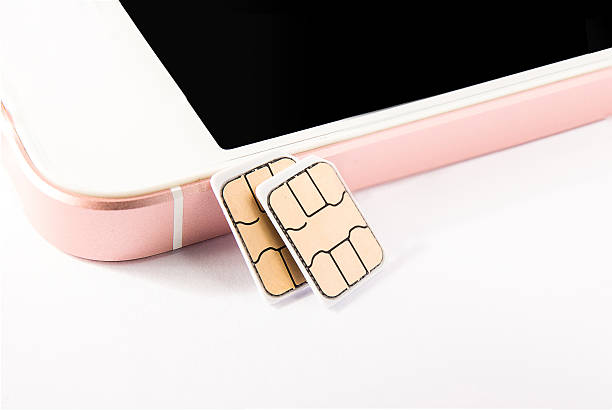nano sim card and smart phone stock photo