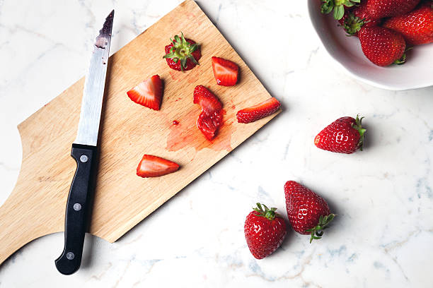 fresh strawberries on cutting board stock photo