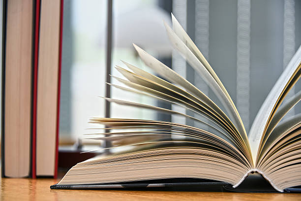 istock Hardcover book lying on the table in a library 599116700