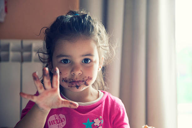 istock Girl with dirty mouth 599118008