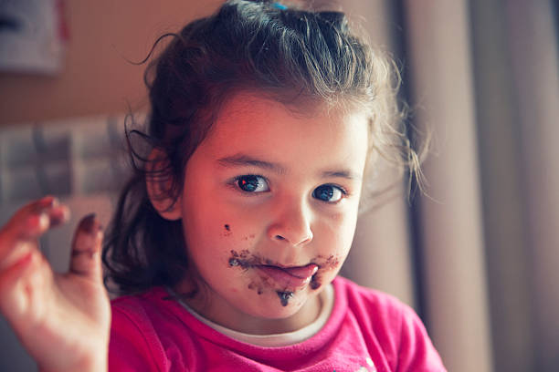 istock Girl with dirty mouth 599118144