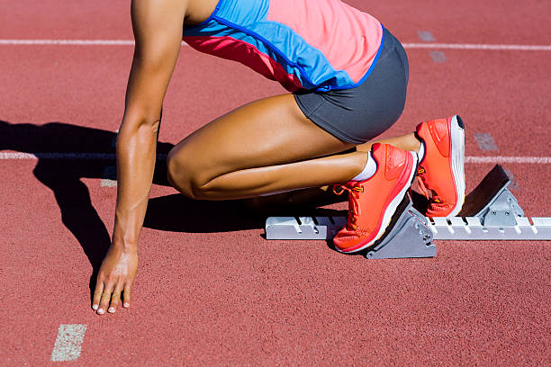 istock Female athlete ready to run on running track 599120504