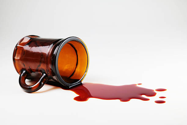 Glass and blood The falling glass with blood spattered on the floor. blood pouring stock pictures, royalty-free photos & images