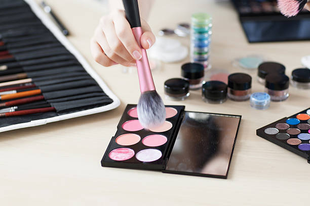 istock Artist taking rouge with brush visagiste workplace 599121534