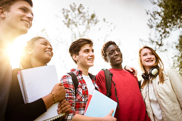 teenagers college student smiling embracing teenagers college student smiling embracing indian man walking in park stock pictures, royalty-free photos & images