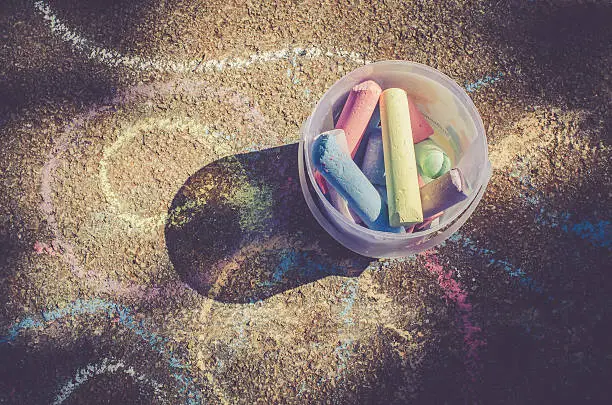 Colorful chalk on the floor; top view, copy space, Croatia, Europe.