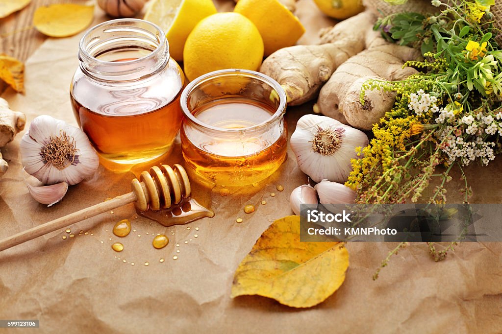Honey Honey, garlic, herbs, lemon and ginger - natural medicine, healthy food Flower Stock Photo