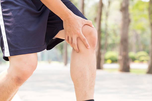 istock Man having knee pain while exercising, Sport injury concept 599123690