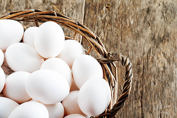 istock Chicken eggs in the basket on wooden background 599124120
