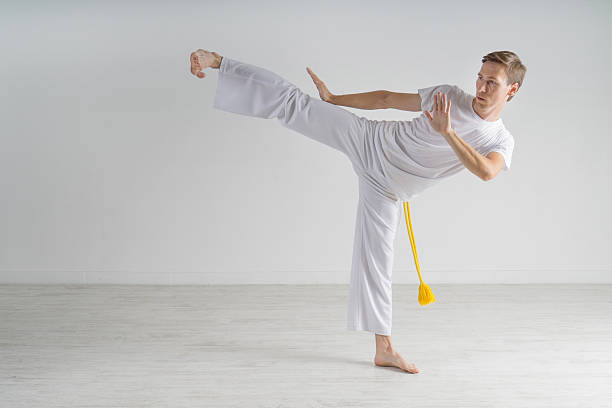 istock Man in sportswear performing a kick. 599124694