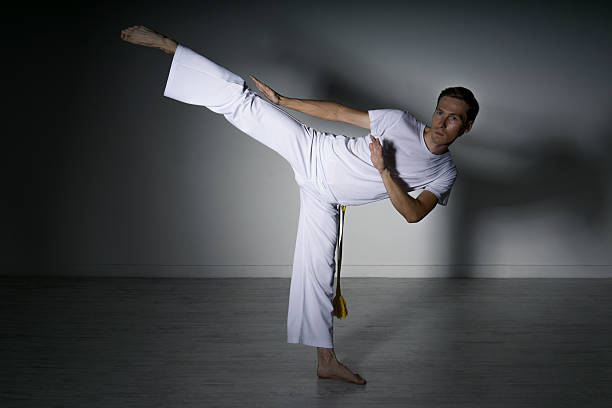 istock Man in sportswear performing a kick. 599124816