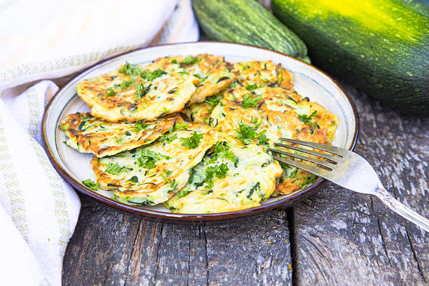istock Squash and zucchini fritters on old wooden table 599126898