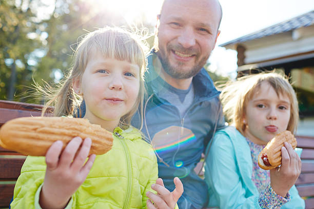 istock Funny Family with Hot Dogs 599128082