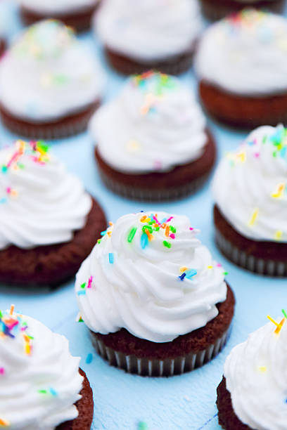 istock Tray of chocolate cupcakes with cream and colorful icing 599130408