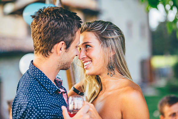 istock romantic couple drinking wine outdoor 599130530