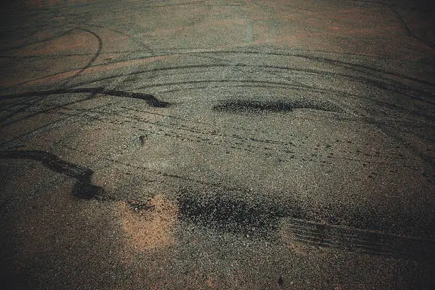 Skid marks caused by cars drifting on the asphalt surface