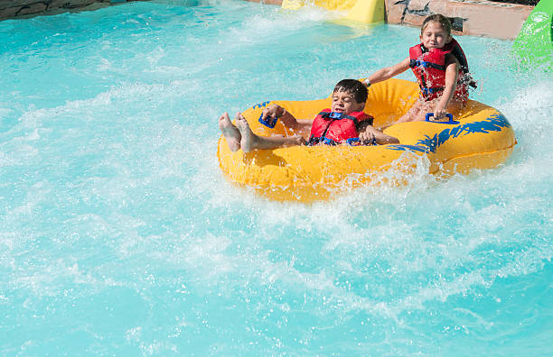 istock Boy and girl riding in a raft 599136872