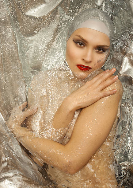istock girl in water with spangles  a make-up 599136960