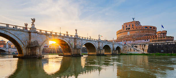 istock Bridge over the Tiber River in Rome at sunset. 599138410