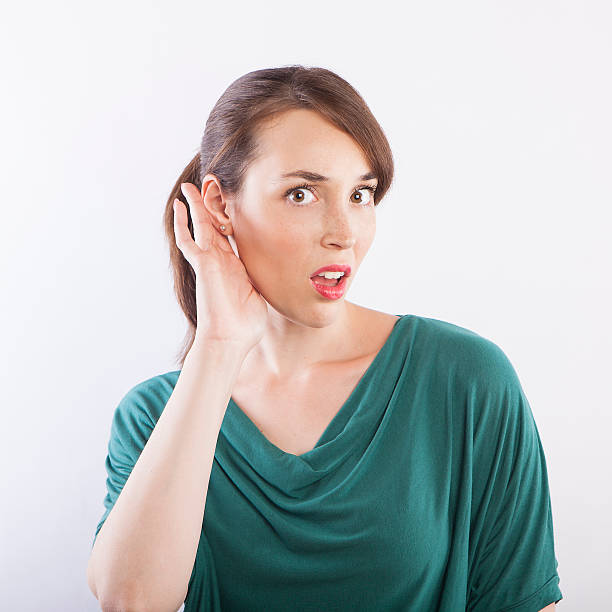 istock young beautiful woman listening, what?! face expression 599139678