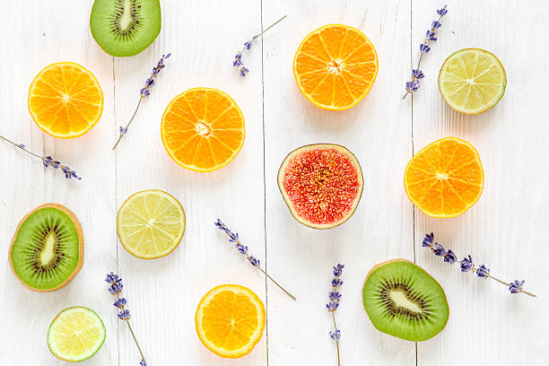 istock Colorful pattern made of halved fruits top view 599140954