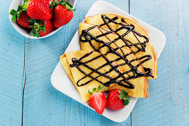 istock pancakes with strawberries and chocolate breakfast 599141052