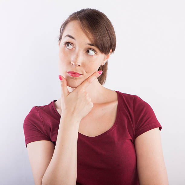 istock young beautiful woman  thinking, pensive face expression 599141172